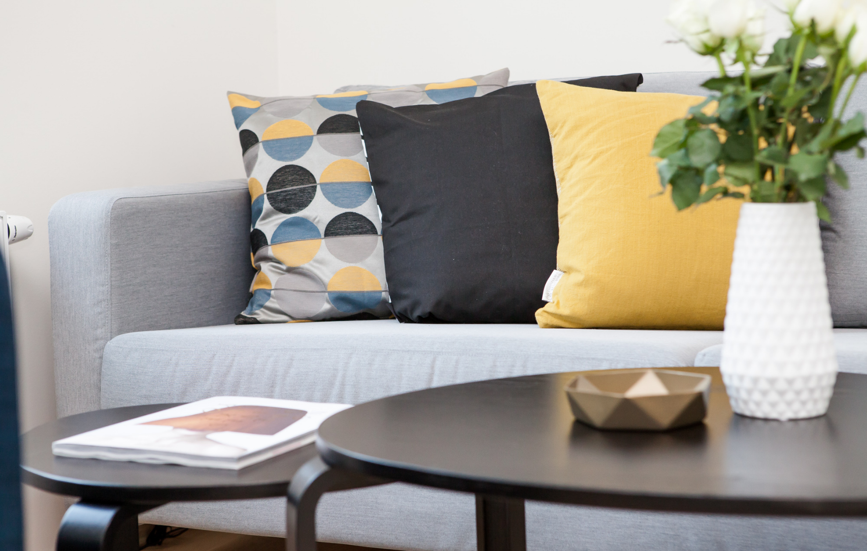 couch with pillows inside an investment property